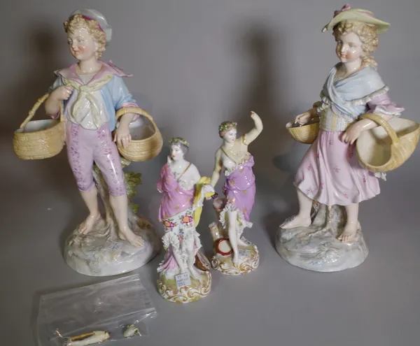 A pair of continental Meissen-style porcelain figures of  boy and girl carrying baskets, 30cm tall and a small pair of continental figures, (a.f.).