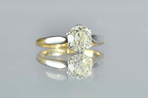 A gold and platinum, diamond set single stone ring, claw set with a cushion shaped diamond, detailed 18CT PLAT 230, ring size Q 1/2, gross weight 4.5g