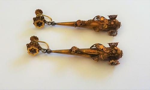 A pair of gold pendant earrings, each with a tapered drop, having applied filligree decoration, the tops with later screw fittings, detailed 9CT, comb