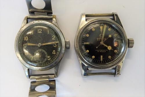 A Titus Calypsomatic steel cased gentleman's wristwatch, the signed black dial with dot and baton numerals, centre seconds and with a date of the mont