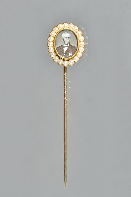 A Victorian gold and half pearl set presentation stick pin, mounted to the centre with an oval photographic portrait of John Brown, within a surround