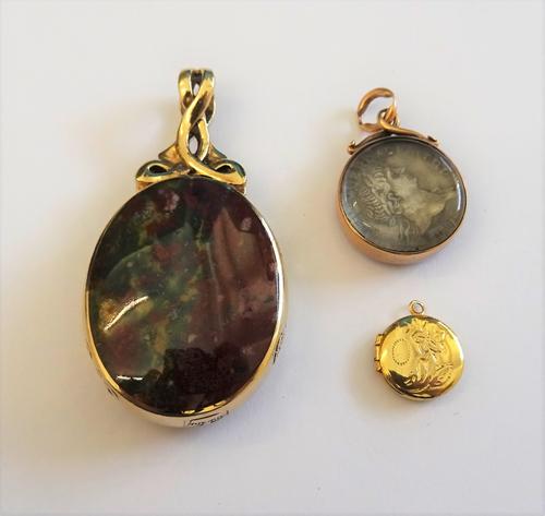 A gold mounted Roman silver denarius coin, glazed to the back and to the front, a 9ct gold mounted vary coloured agate and mother-of-pearl oval pendan