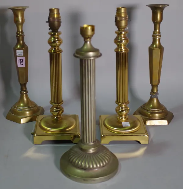 Lighting, comprising; five mid 20th century brass table lamps, to include two pairs and a single, the tallest 32cm high, (5).