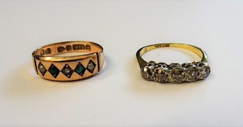 A gold and platinum, diamond set five stone ring, mounted with a row of cushion shaped diamonds graduating in size to the centre stone, detailed 18CT