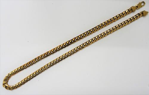 A 9ct gold faceted curb link neckchain, on a sprung hook shaped clasp, length 50cm, weight 60.5 gms.