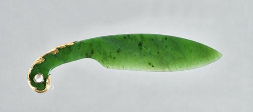 A gold mounted nephrite paper knife, the handle with an applied gold mount, set with a cabochon moonstone to each side, detailed 56 H.W. and with a co