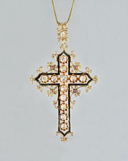 A gold, diamond set and black enamelled pendant cross, probably European, second half of the 19th century, mounted to the centre with twelve cushion s