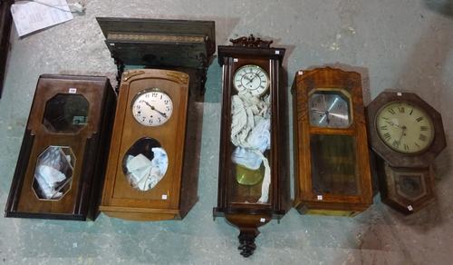 A group of 19th century and later mahogany and oak wall clocks, (a.f.).