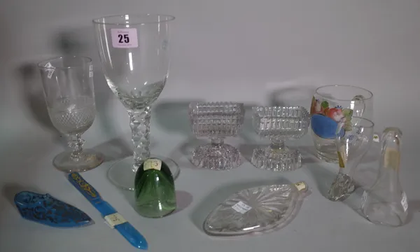 A group of glassware, comprising; a Bohemian blue glass miniature slipper, a small boot shaped stirrup cup, a small green glass tavern measure, a pair