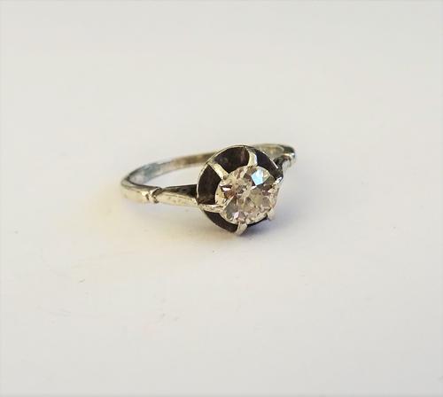 A diamond set and white metal single stone ring, the old mine cut diamond, six claw illusion set in a white metal mount (presumed silver untested), ri