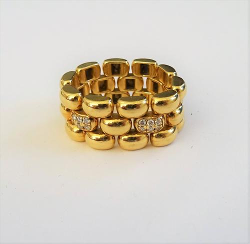 A gold and diamond chain link ring, in a three row domed oval link design, with two diamond set six stone links at intervals, detailed 750 L.U.C, ring