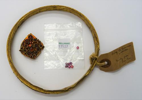 A Burmese gold cased and cabochon ruby set umbrella ring, of circular form, mounted with cabochon rubies, some rubies lacking, diameter 13.3cm, a few