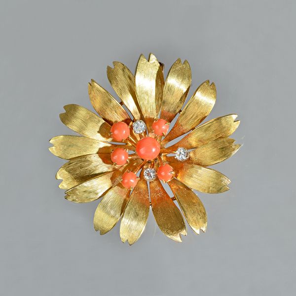 A gold, diamond and coral set pendant brooch, designed as a flowerhead, mounted with three circular cut diamonds and with six corals, otherwise having