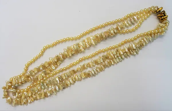 A triple strand cultured and freshwater blister pearl long necklace, suspended from a yellow precious metal clasp, designed as a multiple string of bl