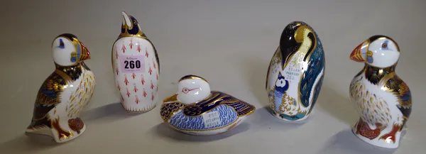 A group of five Royal Crown Derby imari pattern paperweights, comprising; two penguins, two puffins and a duck.