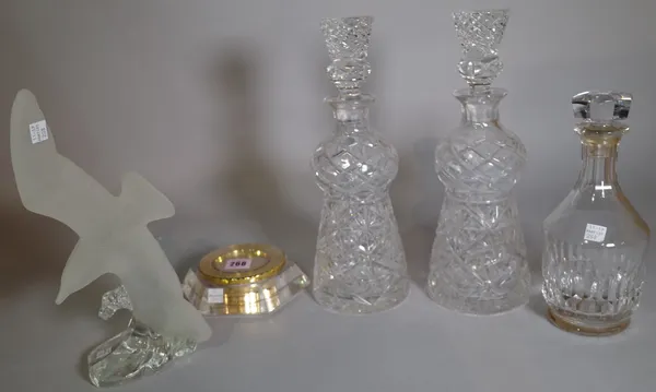 Glassware, including; a Luxor World desk clock by Garrard & Co, a pair of decanters, another decanter and a frosted glass model of a seagull.