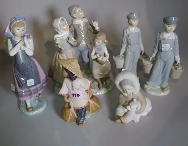 Ceramics, Lladro, a group of six figures including bisque glazed figures, carol singers, etc.