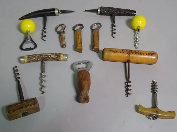 Four late 19th century direct pull corkscrews, each with horn handle, two wooden picnic corkscrews and six further novelty corkscrews, (12).