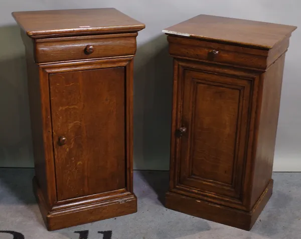 A late 19th century oak cupboard with single drawer, 38cm wide x 73cm high and another similar, (2).