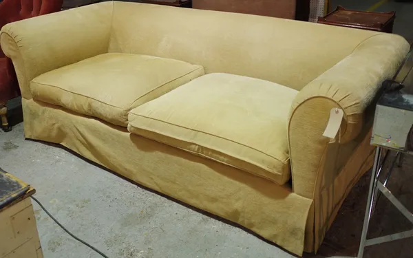 A 20th century hardwood framed sofa with roll over arms and mustard upholstery, 230cm wide.