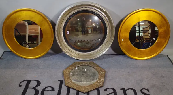 A Regency style silver painted convex wall mirror, 68cm wide, a pair of 20th century gold painted circular wall mirrors, 60cm wide and an embossed cop