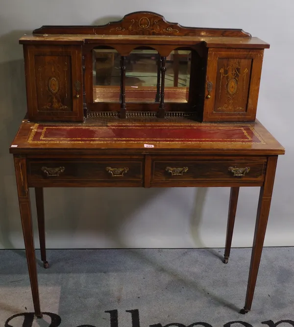 An Edwardian faux painted rosewood and inlaid two drawer writing desk on tapering square supports, 91cm wide x 110cm high.