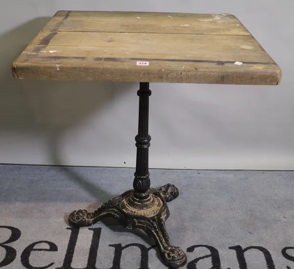 A 20th century cast iron and oak top centre table, 70cm wide x 76cm high.