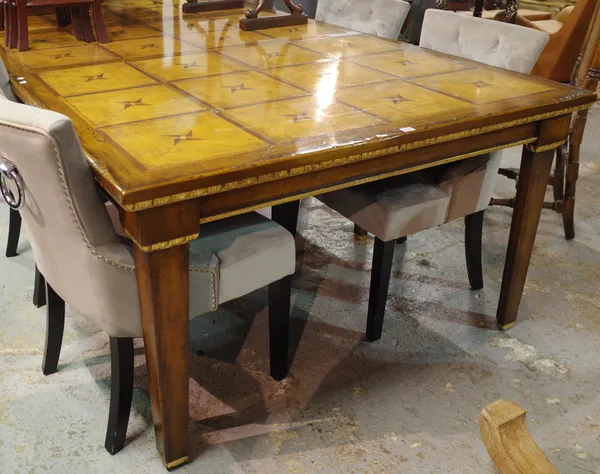 A 20th century stained beech extending dining table with parcel gilt decoration on tapering square supports, 200cm wide x 80cm high.