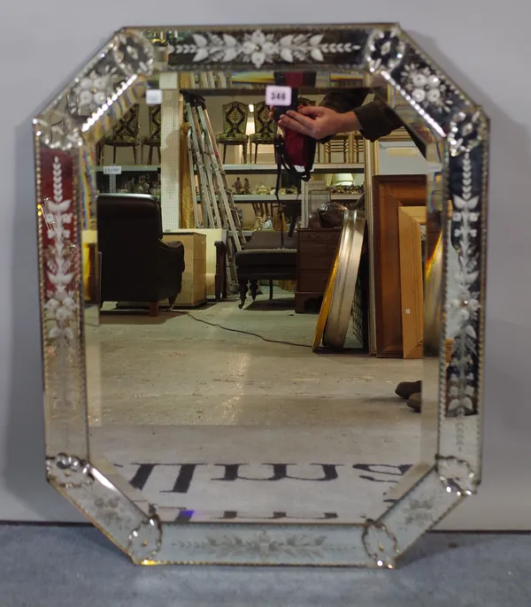 An early 20th century Venetian style octagonal wall mirror with bevelled glass, 60cm wide x 76cm high.