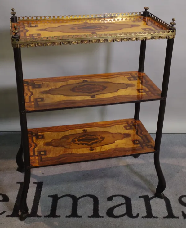 A 19th century continental mahogany and specimen wood inlaid three tier etagere with brass galleried top on ebonised stylised hoof supports, 62cm wide