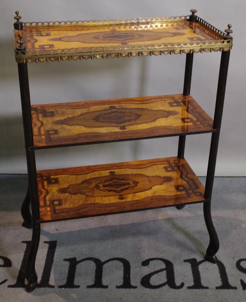 A 19th century continental mahogany and specimen wood inlaid three tier etagere with brass galleried top on ebonised stylised hoof supports, 62cm wide