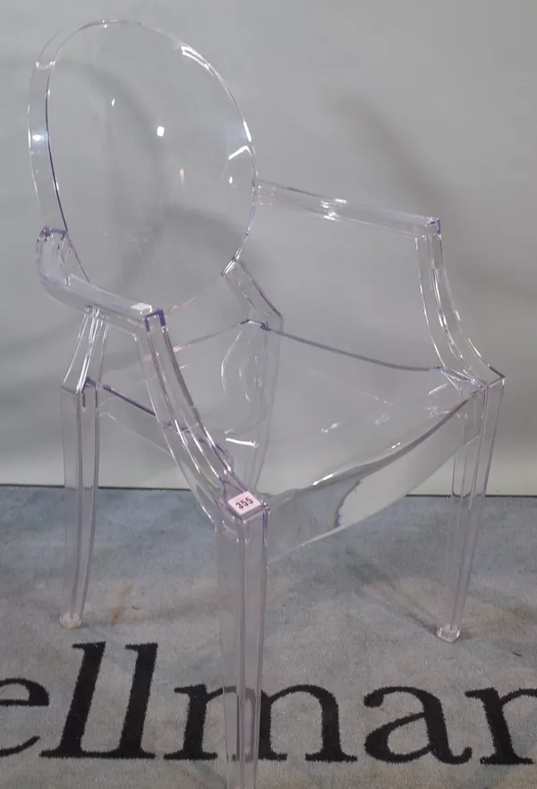 A modern perspex open armchair, 55cm wide x 92cm high.