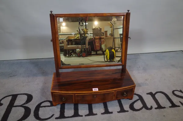 A 19th century mahogany bowfront toilet mirror with three frieze drawers, 52cm wide x 53cm high.