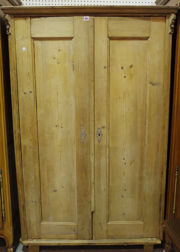 An early 20th century pine double wardrobe, 105cm wide x 170cm high.