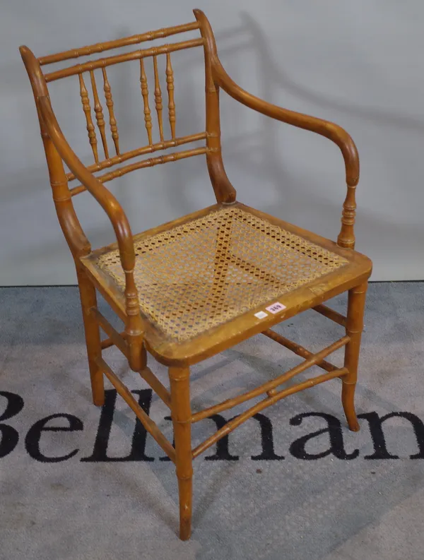 A 19th century stained beech, bamboo open armchair with caned seat, 49cm wide x 83cm high.