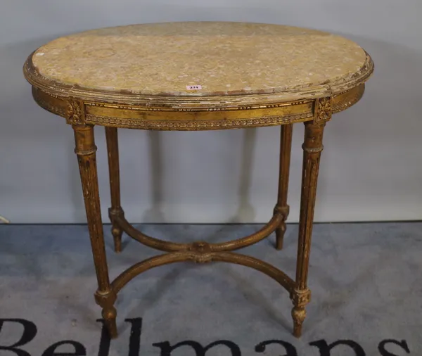 A Louis XV giltwood oval centre table with inset marble top on fluted supports united by 'X' frame stretcher, 85cm wide x 78cm high.