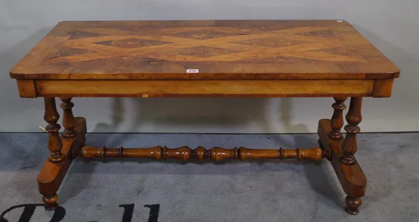 A late Victorian walnut and satinwood inlaid low side table on dual ended supports united by turned stretcher, 106cm wide x 52cm high.