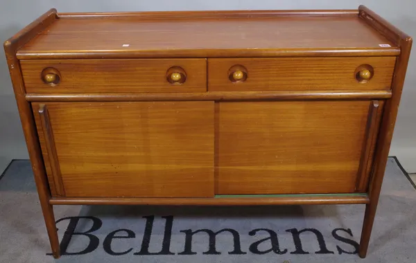 Kendxa; a mid 20th century hardwood sideboard with two drawers over sliding cupboard base, 121cm wide x 88cm high.