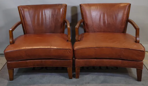 A pair of 20th century mahogany framed low open armchairs with tan leather upholstery on tapering square supports, 84cm wide x 81cm high, (2).