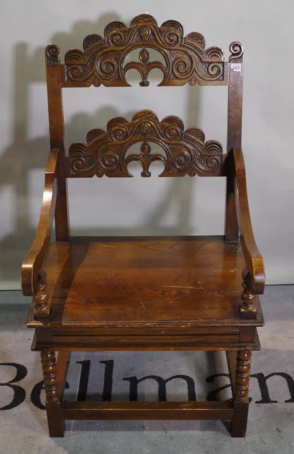 A Charles II style open armchair, 61cm wide x 114cm high.