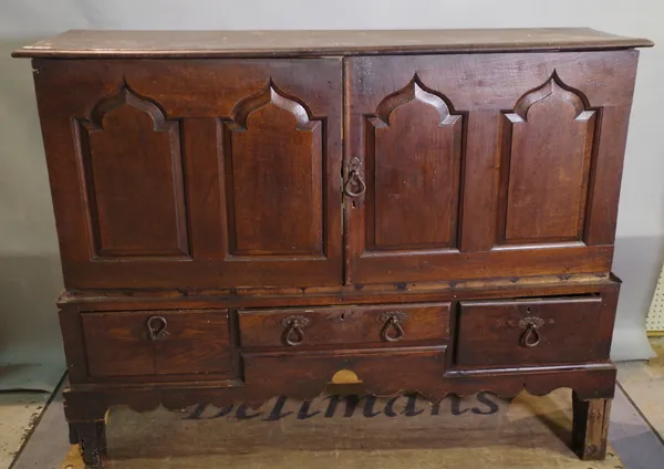 A 17th century oak mule chest, later adapted, 140cm wide x 112cm high.