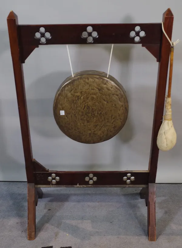 An early 20th century gong within a stained pine frame, 59cm wide x 96cm high.