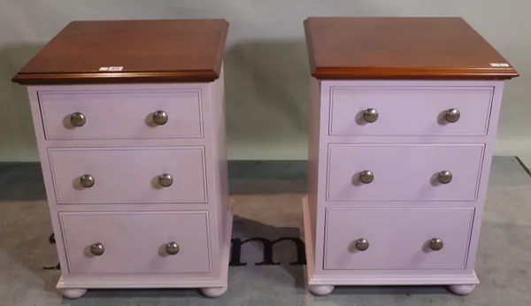 Chalon; a pair of 20th century mahogany bedside chests with three short drawers on bun feet, 47cm wide x 61cm high.