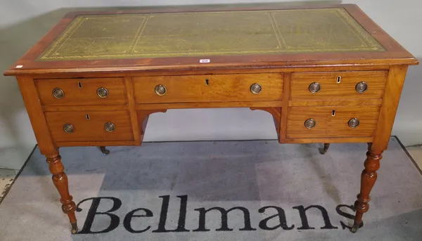 A Victorian mahogany writing desk with five drawers about the knee on tapering turned supports 130cm wide x 79cm high.