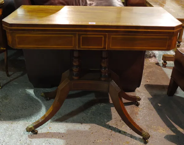 A George III inlaid mahogany foldover card table on four downswept supports, 91cm wide x 73cm high.