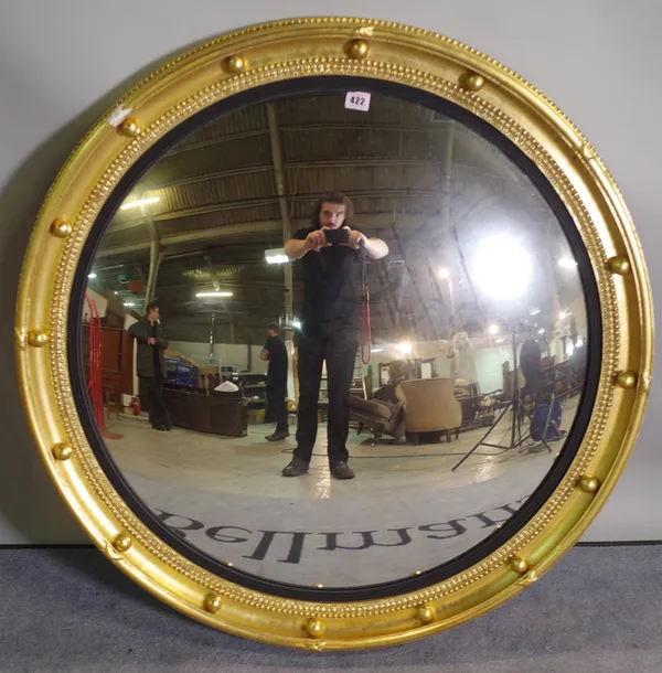 A Regency style giltwood convex mirror, 90cm wide.