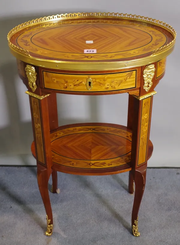 A Regency style specimen wood inlaid oval gilt metal mounted oval two tier side table, 46cm wide x 71cm high.