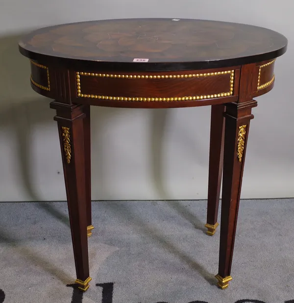 A Regency stained beech and parcel gilt painted oval side table on tapering square supports 66cm wide x 69cm high.