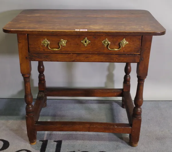 A late 18th century style oak single drawer side table.