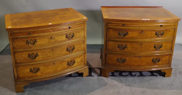 A pair of Regency style walnut and mahogany bowfront bedside chest with three long graduated drawers, 58cm wide x 53cm high, (2).